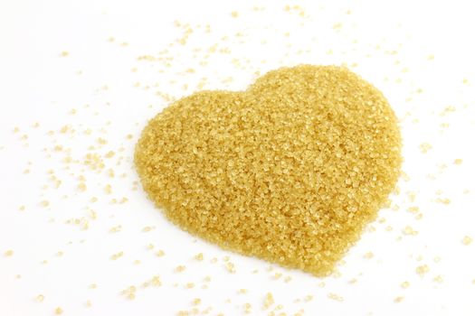 Sugar, Heart-shaped of Sugar from sugarcane top view, Background granulated sugar yellow brown, Sucrose red sugar heap