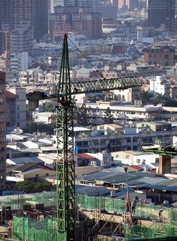 Construction site with a crane seen from above
