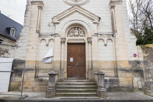 Tours, France - February 8, 2020: architectural detail of the Romanian Orthodox Parish Saint Nectaire de Tours and the Saint Francois chapel in the city center on a winter day