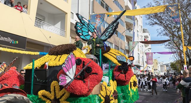 Loule, Portugal - February 25, 2020: Float parading in the street in front of the public in the parade of the traditional carnival of Loule city on a February day