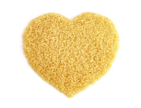 Heart-shaped of Sugar from sugarcane top view, Background granulated sugar yellow brown, Sucrose sugar, Red sugar