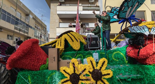 Loule, Portugal - February 25, 2020: Float parading in the street in front of the public in the parade of the traditional carnival of Loule city on a February day