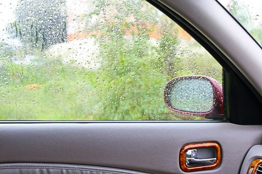 Water Raindrop Fresh on windshield,Feeling relax or lonely in a car, Cleaning Glass Automotive