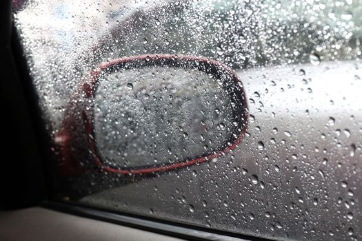 Water drop nature fresh wet background with water raindrops transparency on glass window car mirror side, Alone feeling