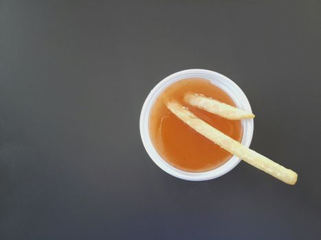 sauce french fries, french fries in chili sauce cup
