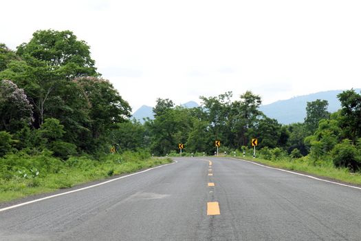 road, street, avenue roadway, countryside road and curve traffic signs in the left Thailand