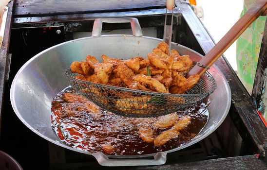 banana fried in a pan heating oil, banana fried of thai asian easy food street
