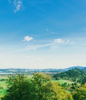 Beautiful nature of European Alps, landscape view of alpine mountains, lake and village in spring season, travel and destination scenery