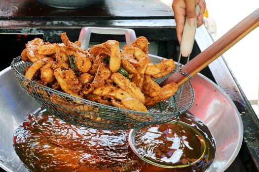 banana fried in a pan heating oil, banana fried of thai asian easy food street