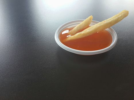 sauce french fries, french fries in chili sauce cup