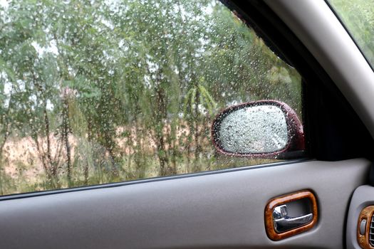 Water Raindrop Fresh on windshield,Feeling relax or lonely in a car, Cleaning Glass Automotive