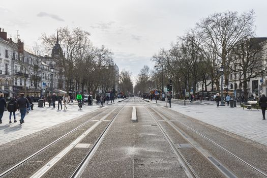 Tours, France - February 8, 2020: travelers in the Jean Jaures electric tram and bus station near the town hall on a winter day