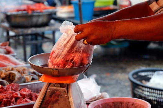 fresh pork market, meat in vegetable market and Merchants are sliced meat with a knife,