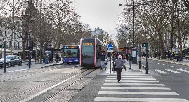 Tours, France - February 8, 2020: travelers in the Jean Jaures electric tram and bus station near the town hall on a winter day