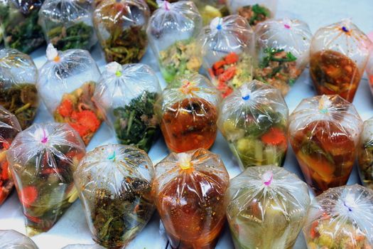 khawkang, kangthung, khangtook (thai word) bag of curry, thai street foods in bag at market countryside