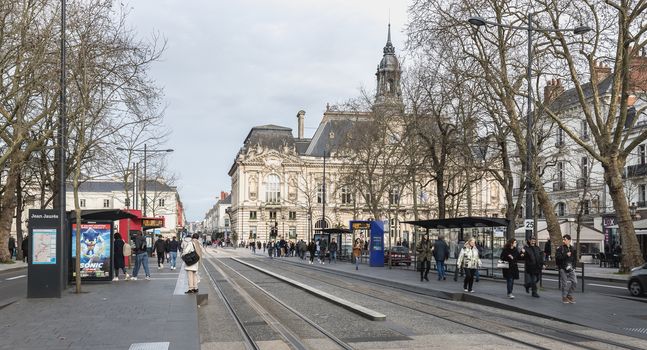 Tours, France - February 8, 2020: travelers in the Jean Jaures electric tram and bus station near the town hall on a winter day