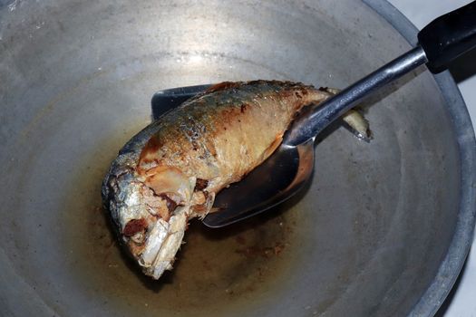 Fried Mackerel fish in a pan with hot boiling oil, Salted Mackerel fish Fried foods