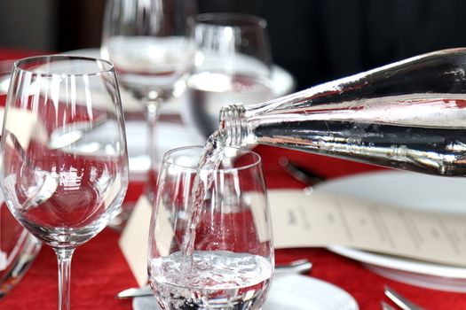 glass of water and bottle pour water in glass, cold water, water drink