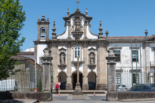 Guimaraes, Portugal - May 10, 2018: Convent of Santo Antonio dos Capuchos in the historic city center as tourists visit on a spring day