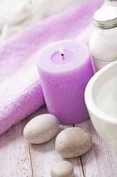 SPA still life. lavender flowers, pebbles, aromatherapy candle, essential oil and bath products