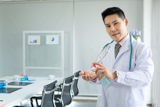 Hand wash gel or antiseptic In the doctor's hands An Asian male doctor is suggesting a way to wash your hands with an antiseptic. Caring for patients at the hospital