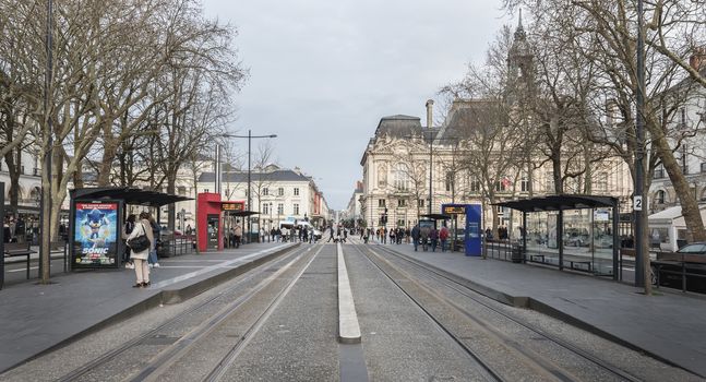 Tours, France - February 8, 2020: travelers in the Jean Jaures electric tram and bus station near the town hall on a winter day