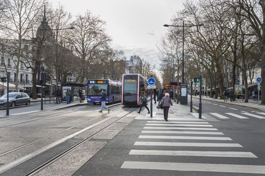 Tours, France - February 8, 2020: travelers in the Jean Jaures electric tram and bus station near the town hall on a winter day