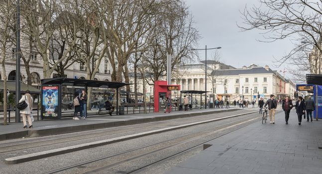 Tours, France - February 8, 2020: travelers in the Jean Jaures electric tram and bus station near the town hall on a winter day