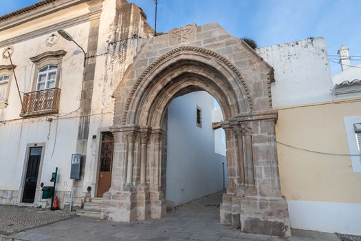 Loule, Faro, Portugal - February 25, 2020: architectural detail of the remains of the door of the old monastery of Saint Francis (Convento da Graça) in the historic city center on a winter day