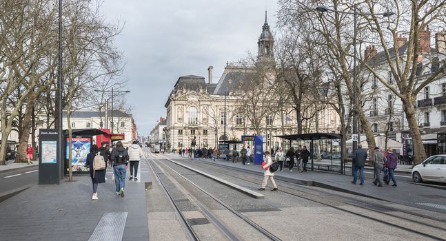 Tours, France - February 8, 2020: travelers in the Jean Jaures electric tram and bus station near the town hall on a winter day