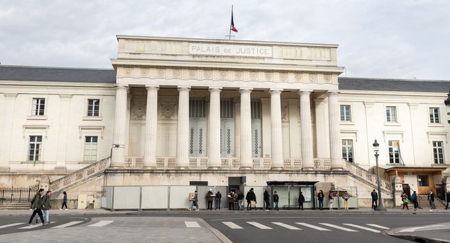 Tours, France - February 8, 2020: people walking in front of the Palais de Justice (Court of Justice) on a winter day in the city center