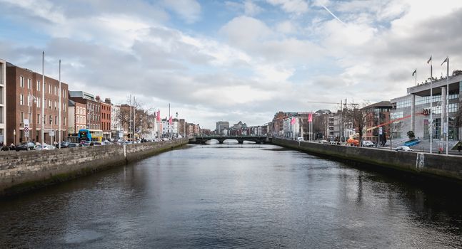 Dublin, Ireland - February 16, 2019: mix of modern and old architecture along the Liffey River in the city center on a winter day