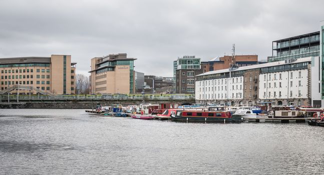 Dublin, Ireland - February 12, 2019: mix of modern and old architecture along the Liffey River in the city center on a winter day