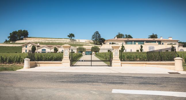 Saint Emilion, France - May 26, 2017: storefront of the building of a Saint Emilion grand cru wine producer, Chateau Pavie on a spring day