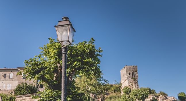 vintage wrought iron floor lamp in the small town center of Saint Emilion, France