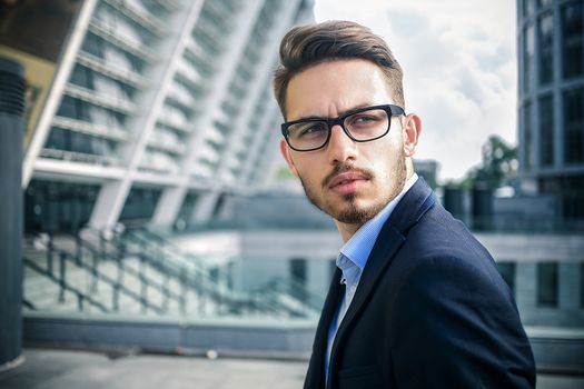 Happy businessman stand on stairs and dreaming about something.
