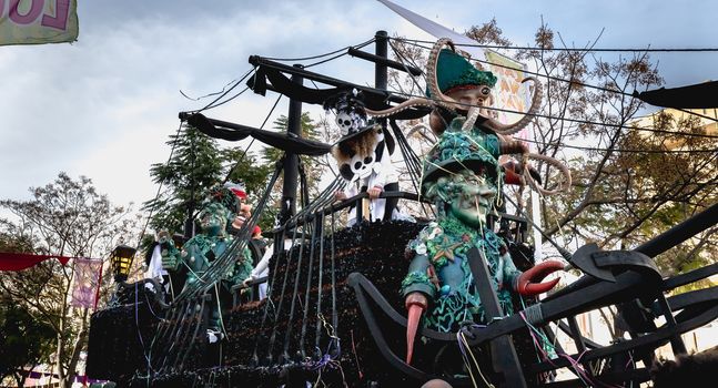 Loule, Portugal - February 25, 2020: Float parading in the street in front of the public in the parade of the traditional carnival of Loule city on a February day