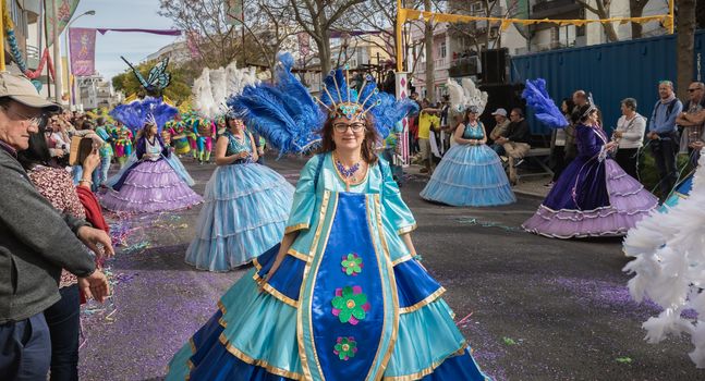 Loule, Portugal - February 25, 2020: dancers parading in the street in front of the public in the parade of the traditional carnival of Loule city on a February day