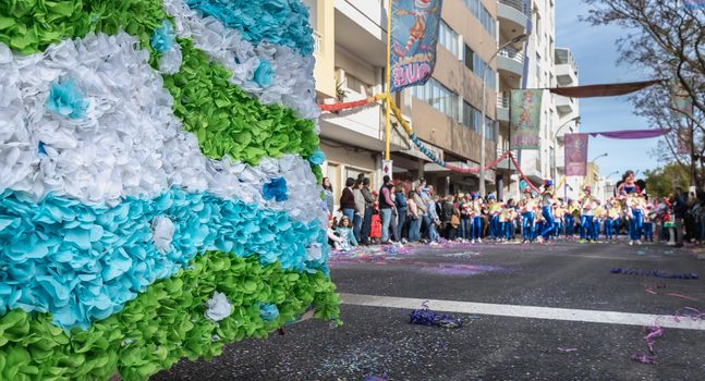 Loule, Portugal - February 25, 2020: dancers parading in the street in front of the public in the parade of the traditional carnival of Loule city on a February day