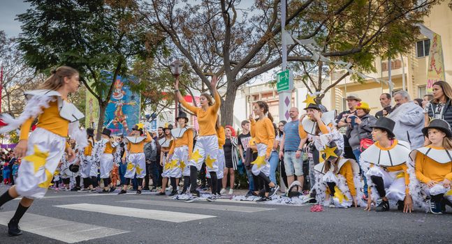 Loule, Portugal - February 25, 2020: dancers parading in the street in front of the public in the parade of the traditional carnival of Loule city on a February day