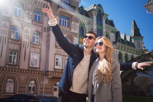 Couple walks in the beautiful city,bright day