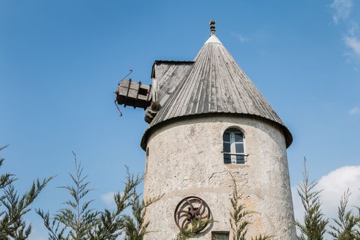 Noirmoutier, France - March 17, 2016: view of an old stone windmill out of use typical of the island of Noirmoutier without its sails