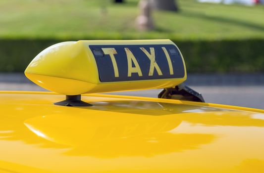 Detail of the taxi car old sign on the roof