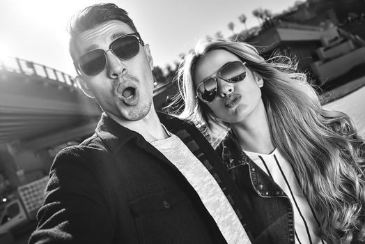 Happy young couple in love takes a selfie portrait.