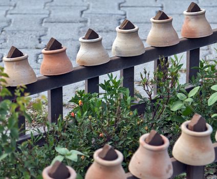 Turkish dish in the pot that is broken before use is called Testi-kebab on fence