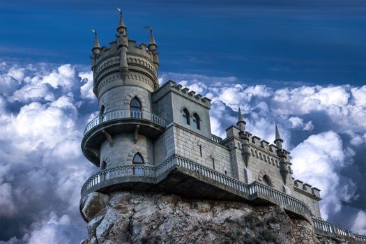The castle Swallow's nest. The village of Gaspra on the Crimean background of the cloudy sky, Top of the 40-metre (130 ft) high Aurora Cliff, in a Neo-Gothic design.
