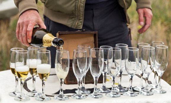 Sparkling Bottle Champagne glass with more glasses, Celebration concept drink