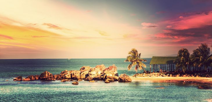 Sunrise Tropical landscape sea, granite rocky beaches on tropical sea.