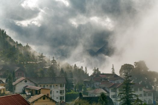 house in dramatic cloudy sky, eco tourism mountain Sa Pa. Lao cai province northern Vietnam
