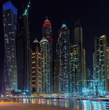 cityscape Dubai marina, Dubai pier, Panorama of illuminated architecture UAE